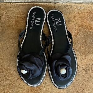 Ninety Union black,‎ satin, crystal, and pearl flower thong sandals